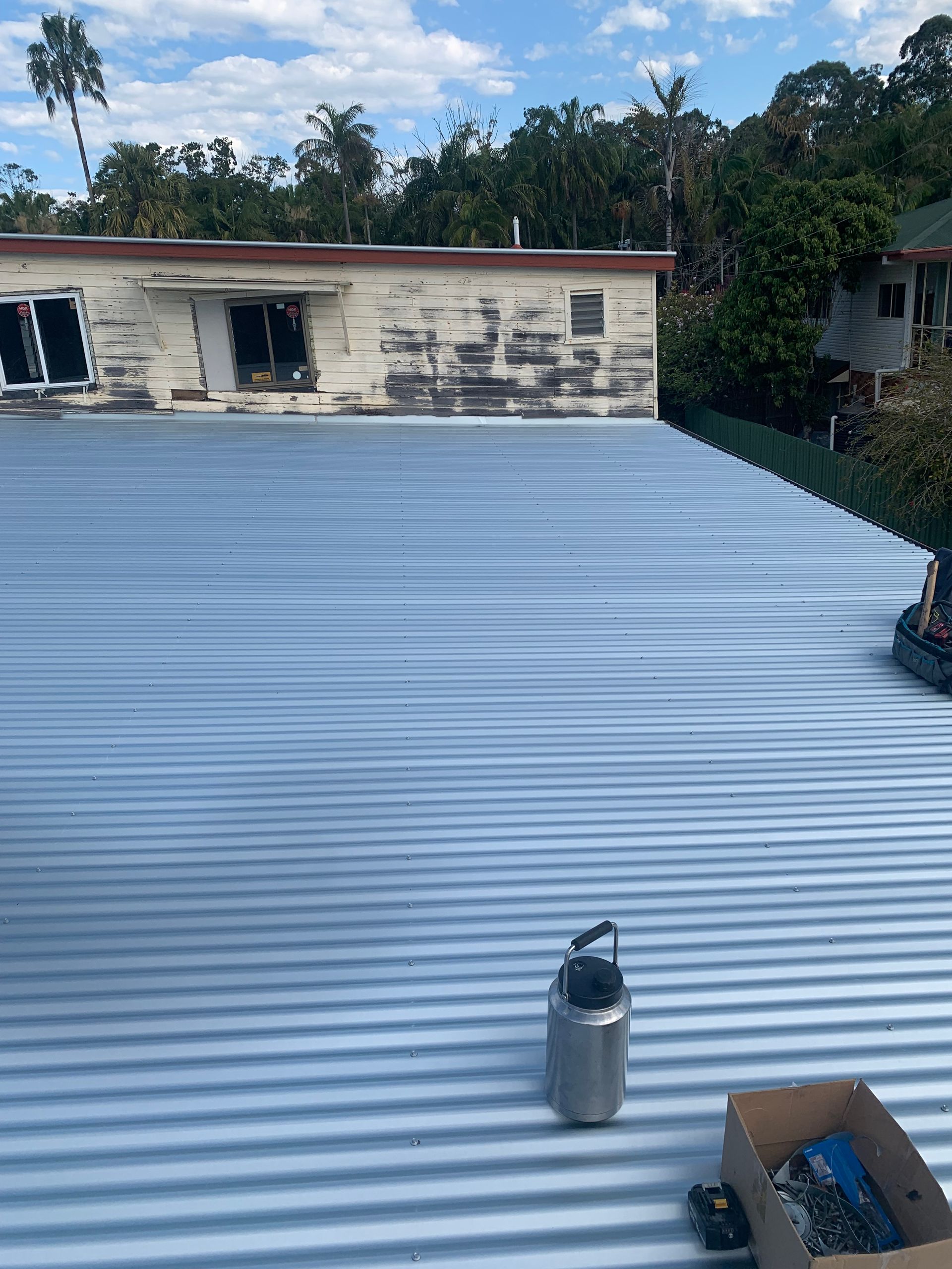 An extreme close up of a silver metal roof top — Blue Sky Roofing NSW In Kingscliff, NSW