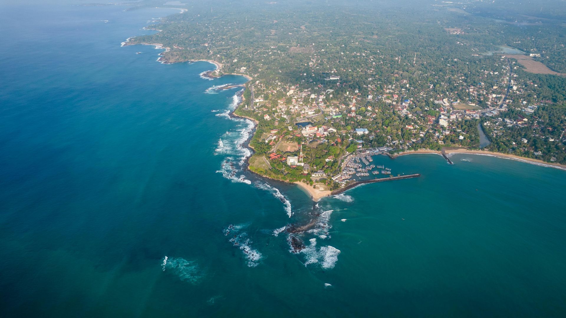 An aerial view of a small island in the middle of the ocean.