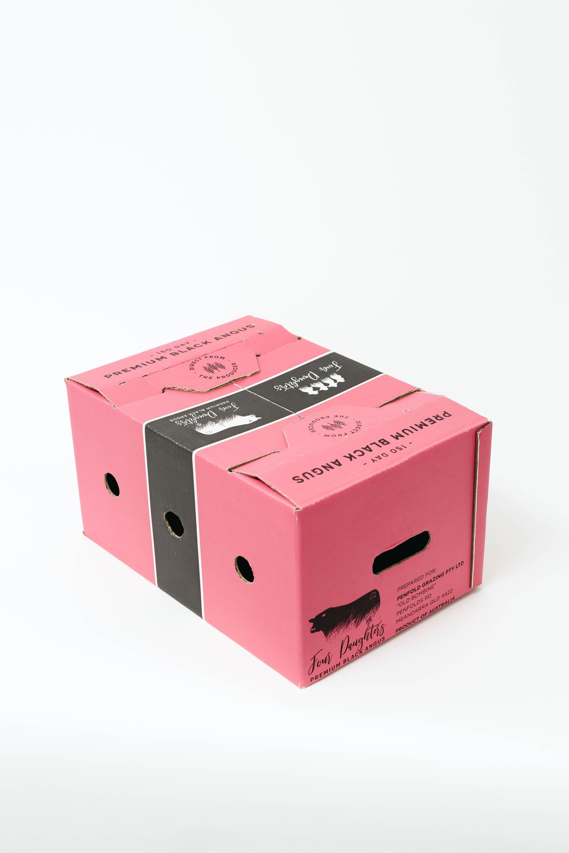 Pink cardboard shipping box with black tape on a white background