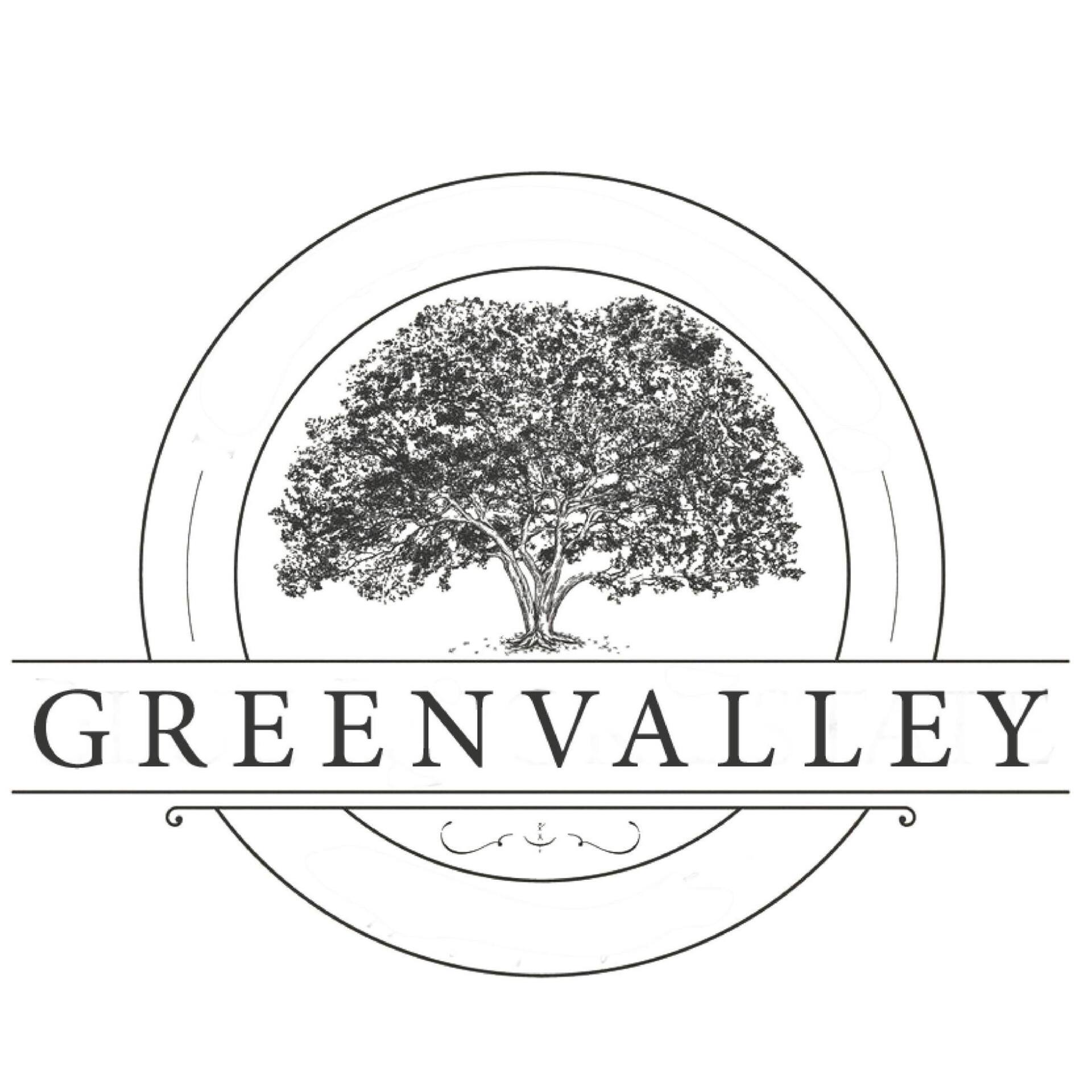 Green Valley logo with a tree inside concentric circles and the name beneath it