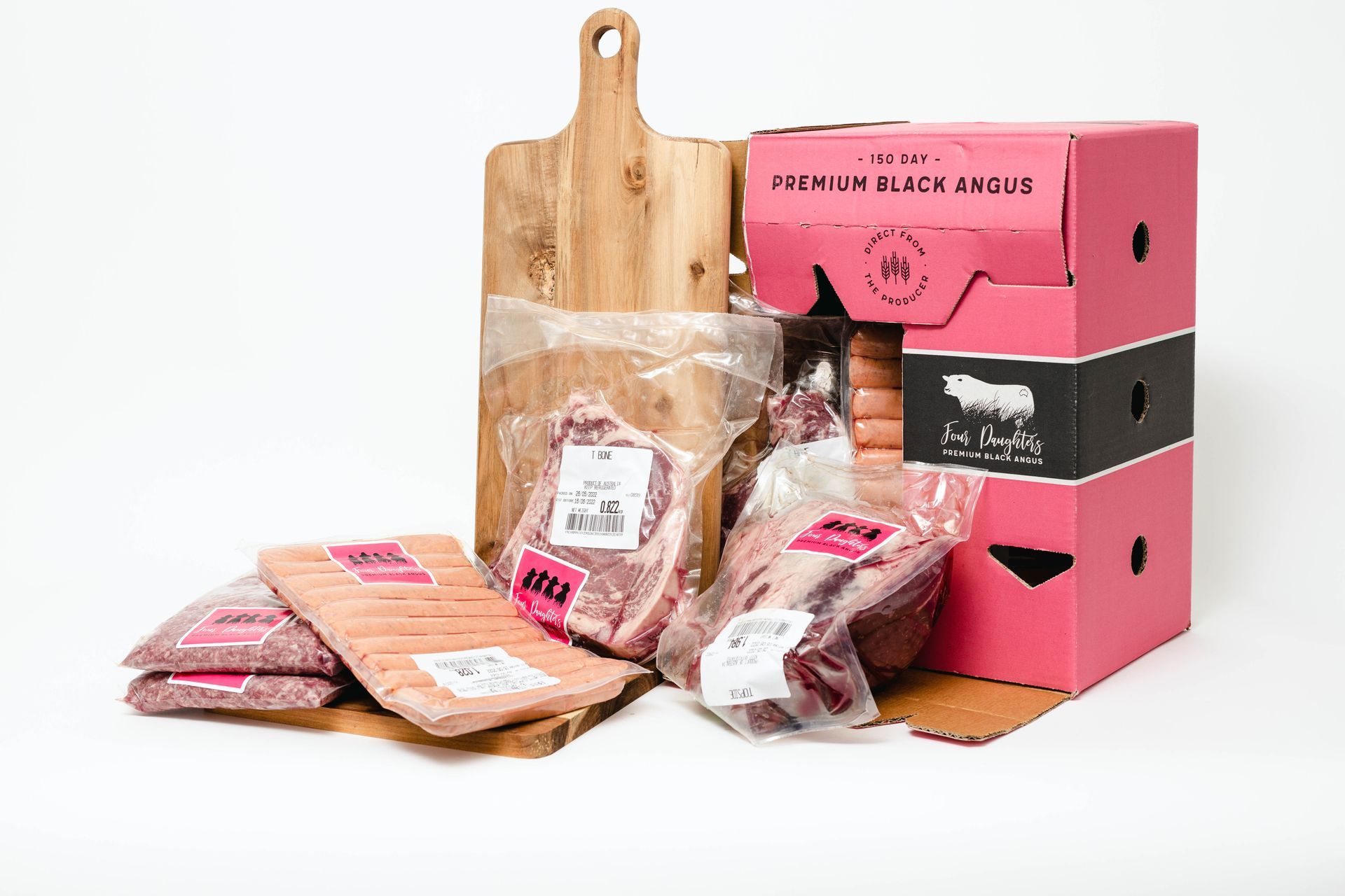 Assorted packaged baked goods and snacks beside pink and black boxes on a white background