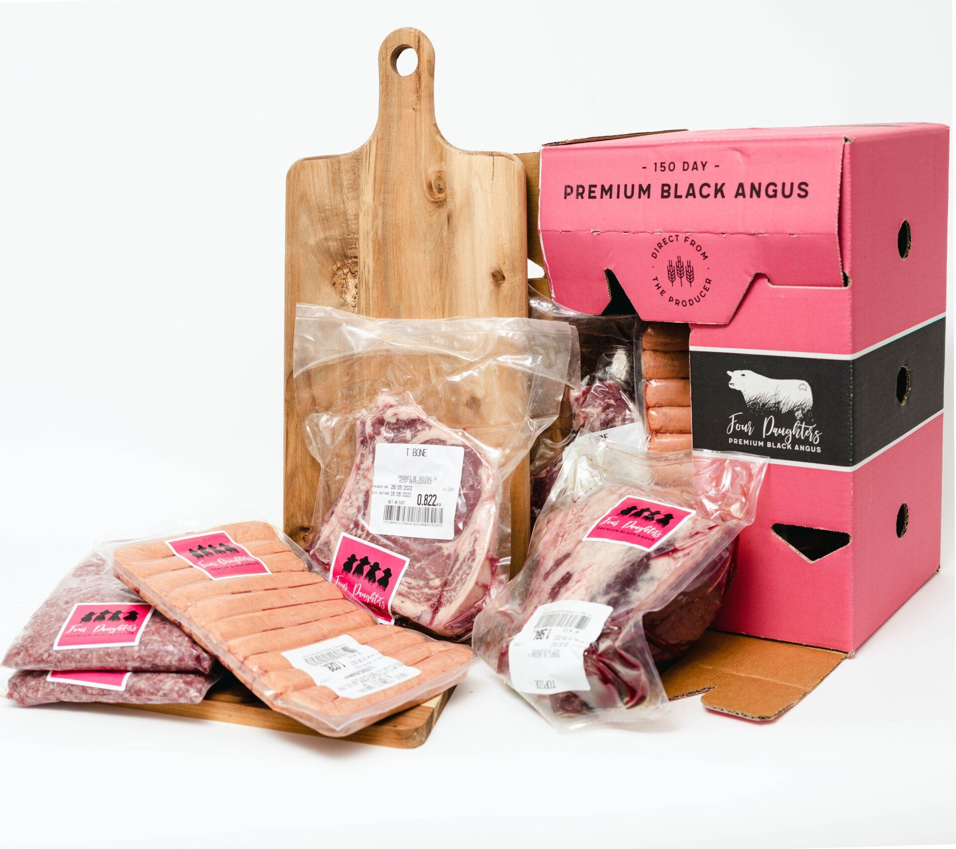Packaged meat cuts and sausages with pink and black premium Angus boxes on a white background