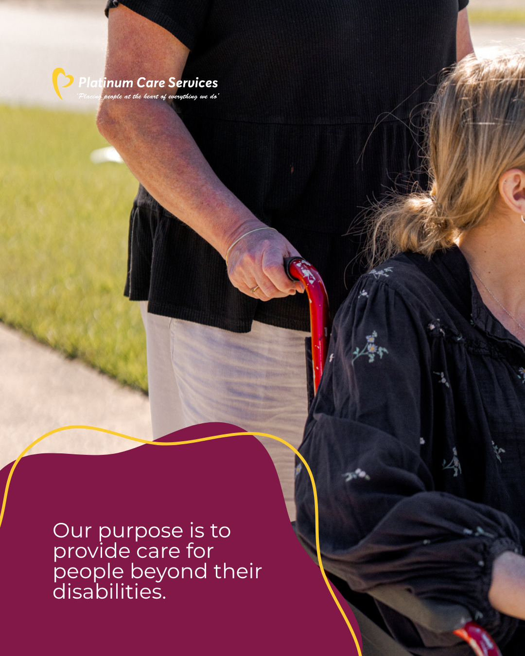 Caregiver in black dress pushes child in wheelchair on a sunlit sidewalk, with nonprofit logo and mission text.