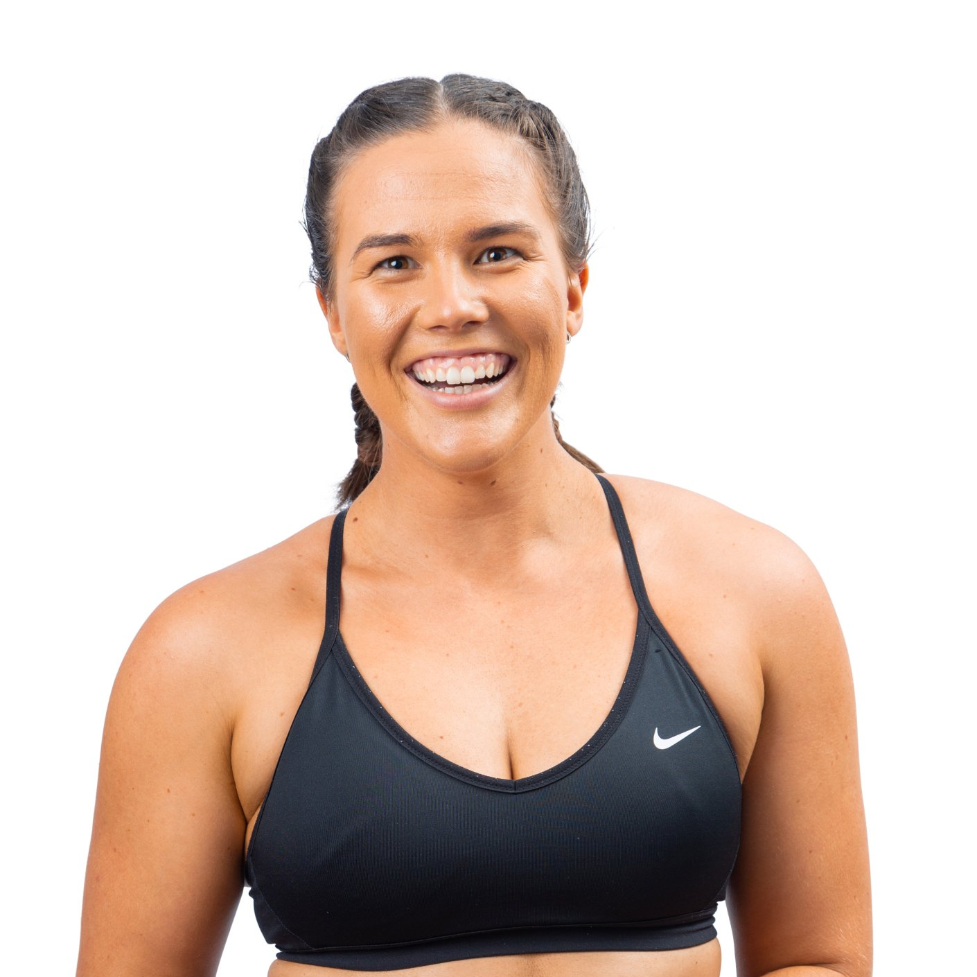 Smiling athlete in a black sports bra on a white background