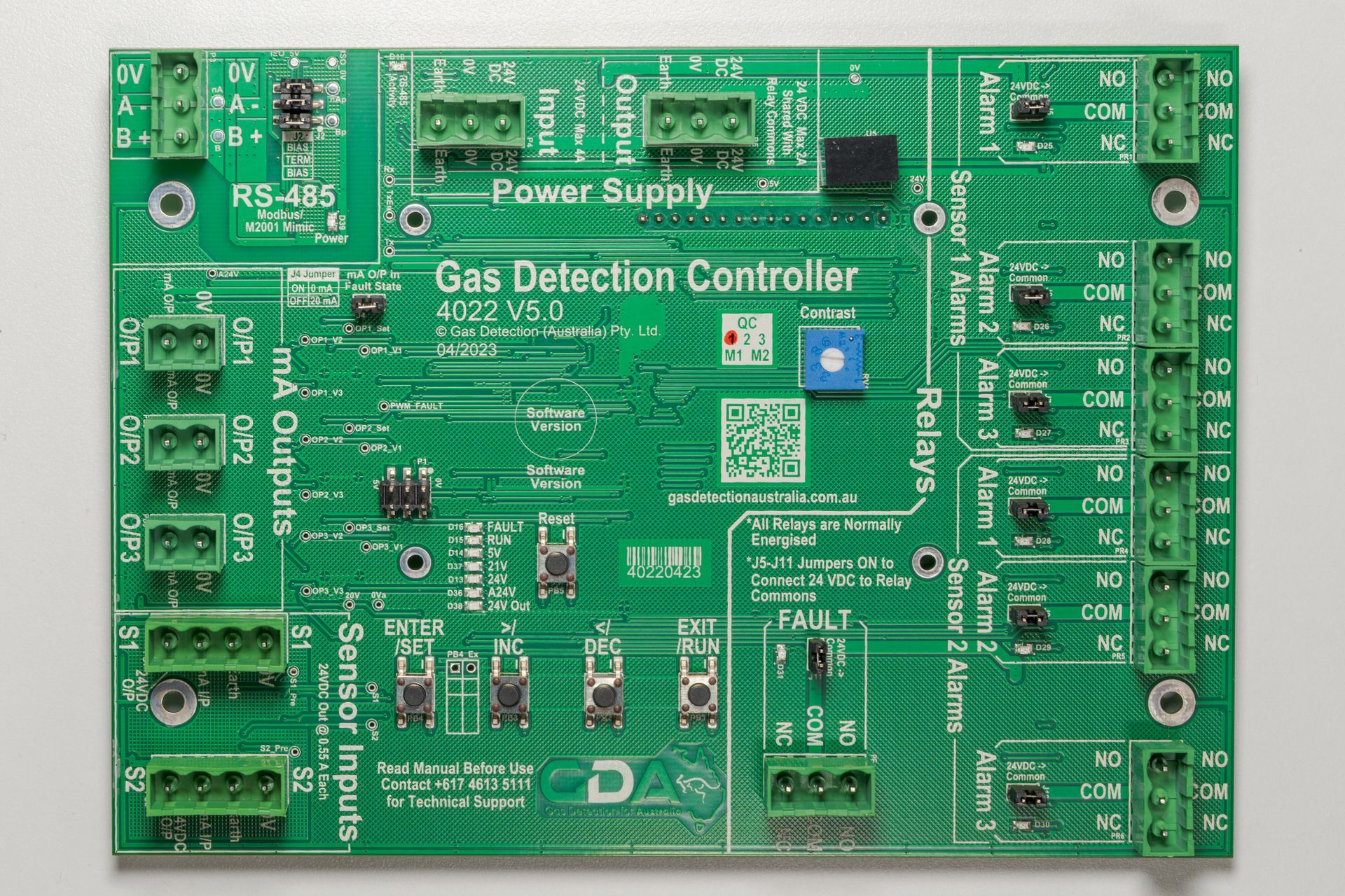 Green gas detection controller circuit board with labeled components and terminal connectors