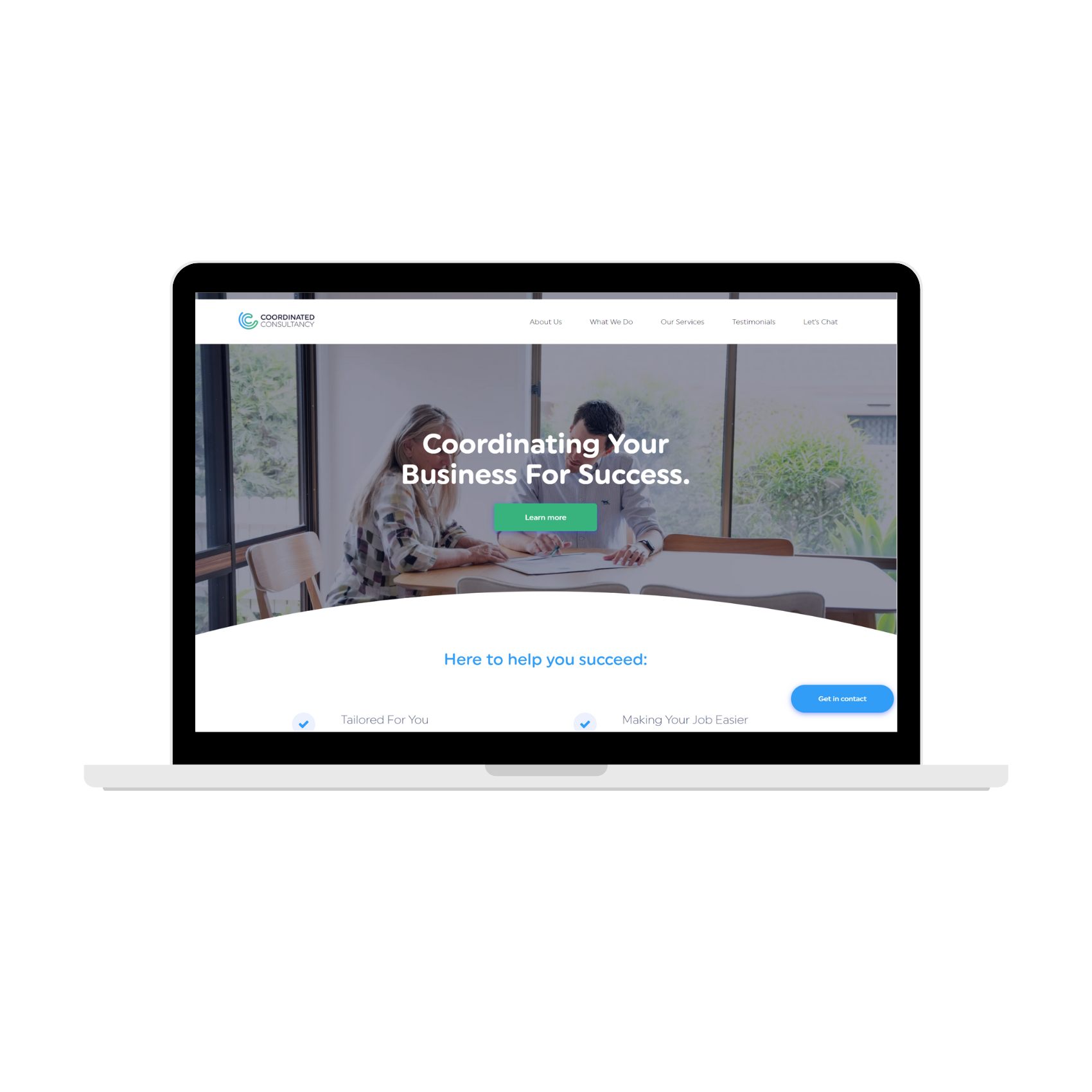 Laptop displaying a business website homepage with a desk photo and the headline “Coordinating Your Business for Success”