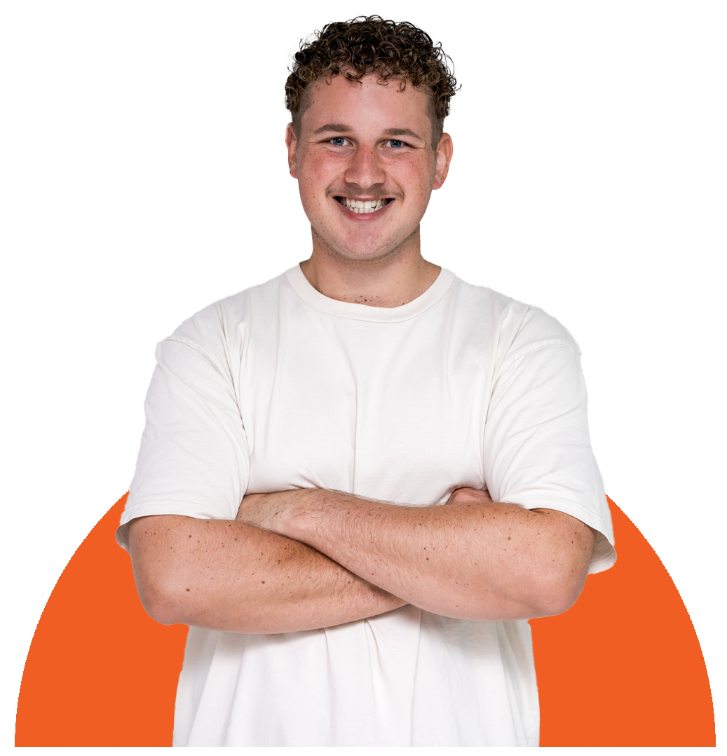 Smiling person in a white shirt with arms crossed, standing against a white background with an orange arc.