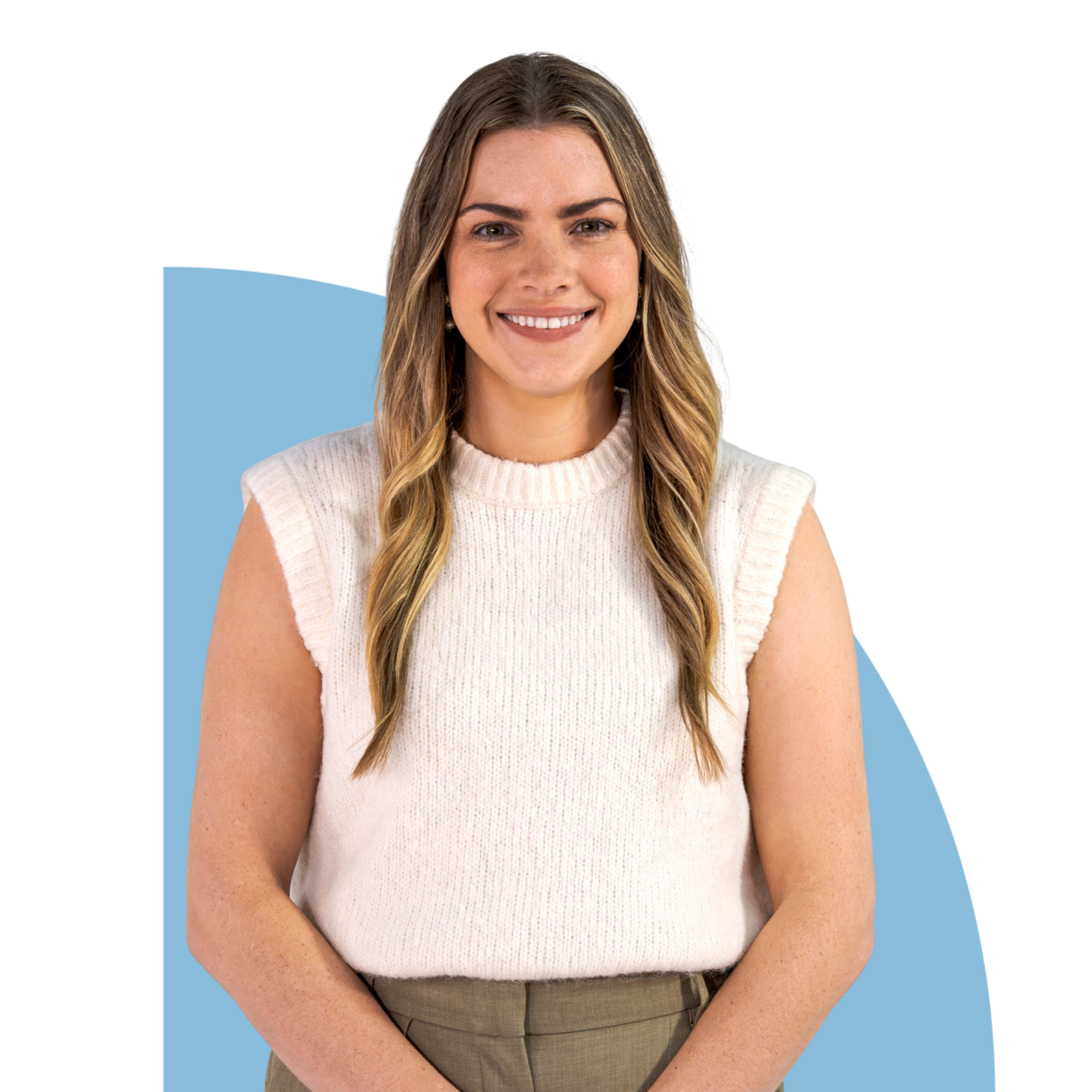 Smiling woman in a white sleeveless top and olive pants against a blue geometric background