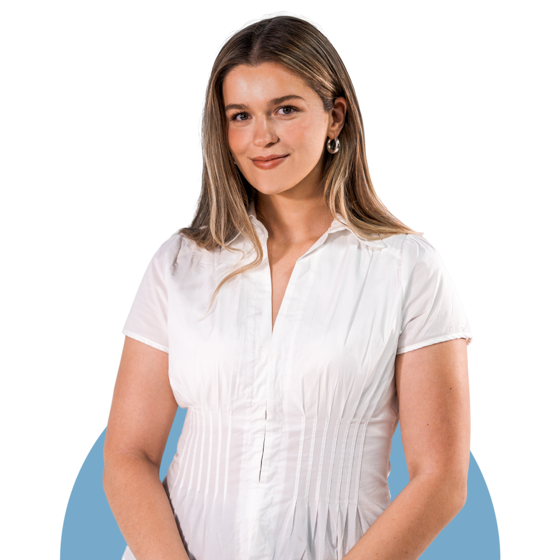 Smiling woman in a white blouse standing against a plain background