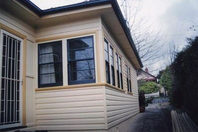 A White House With Black Windows And A Black Door — Yves De Wilde Quality Painting Services In Lismore, NSW
