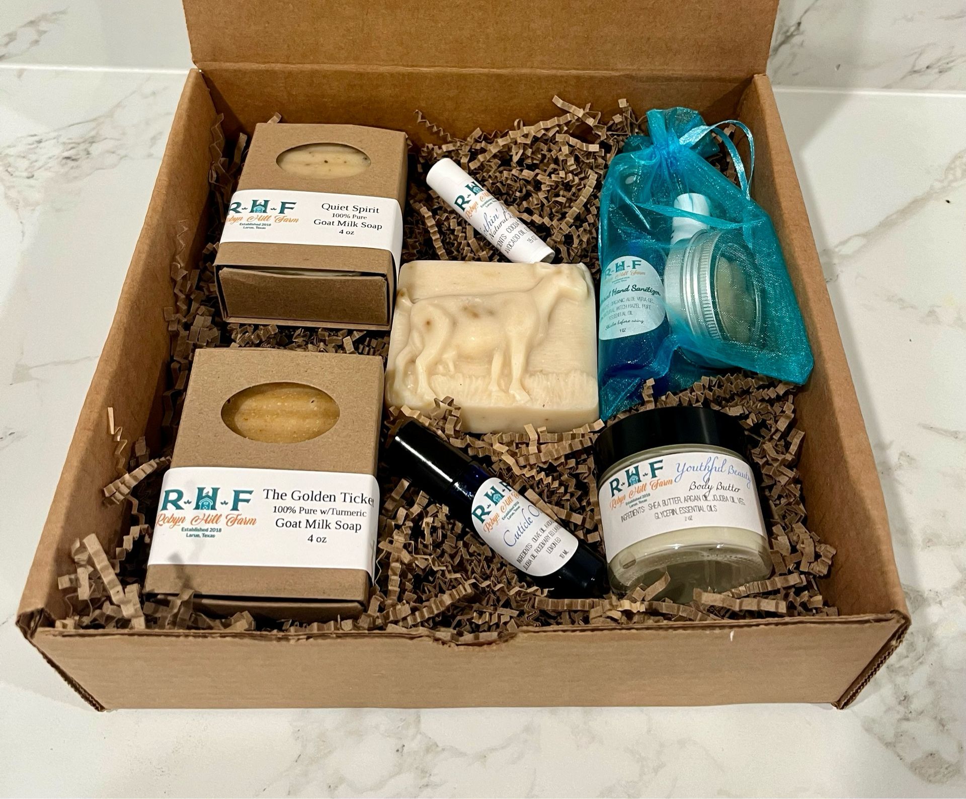 A box filled with a variety of soaps and lotion