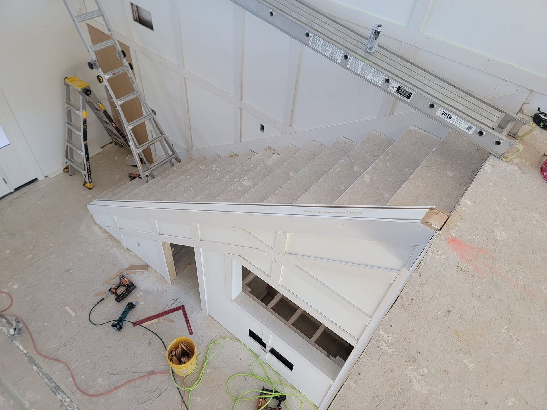 An aerial view of a staircase being built in a house
