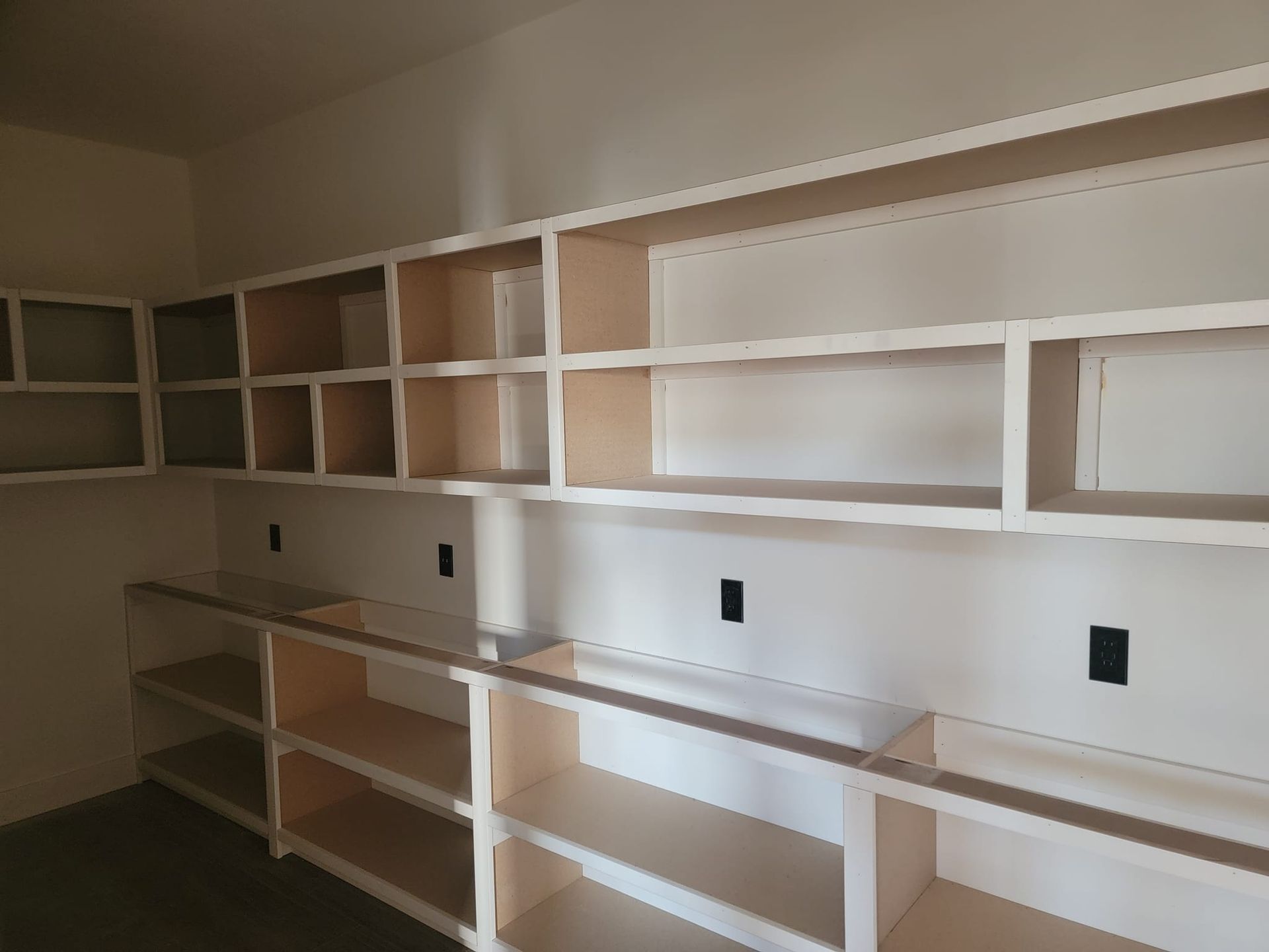 A room with a lot of shelves that are empty