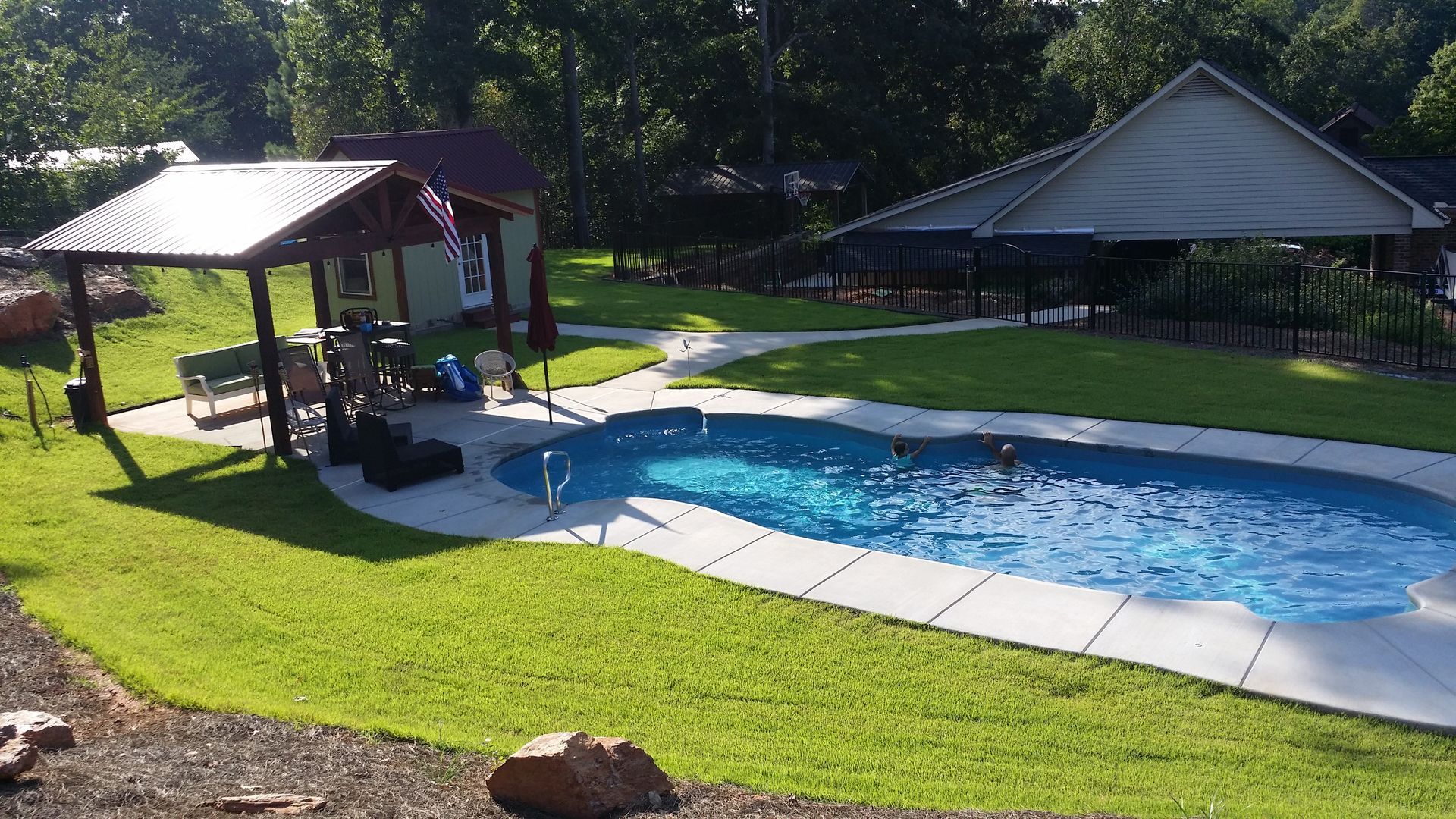 A large swimming pool with a gazebo in the background macedonia