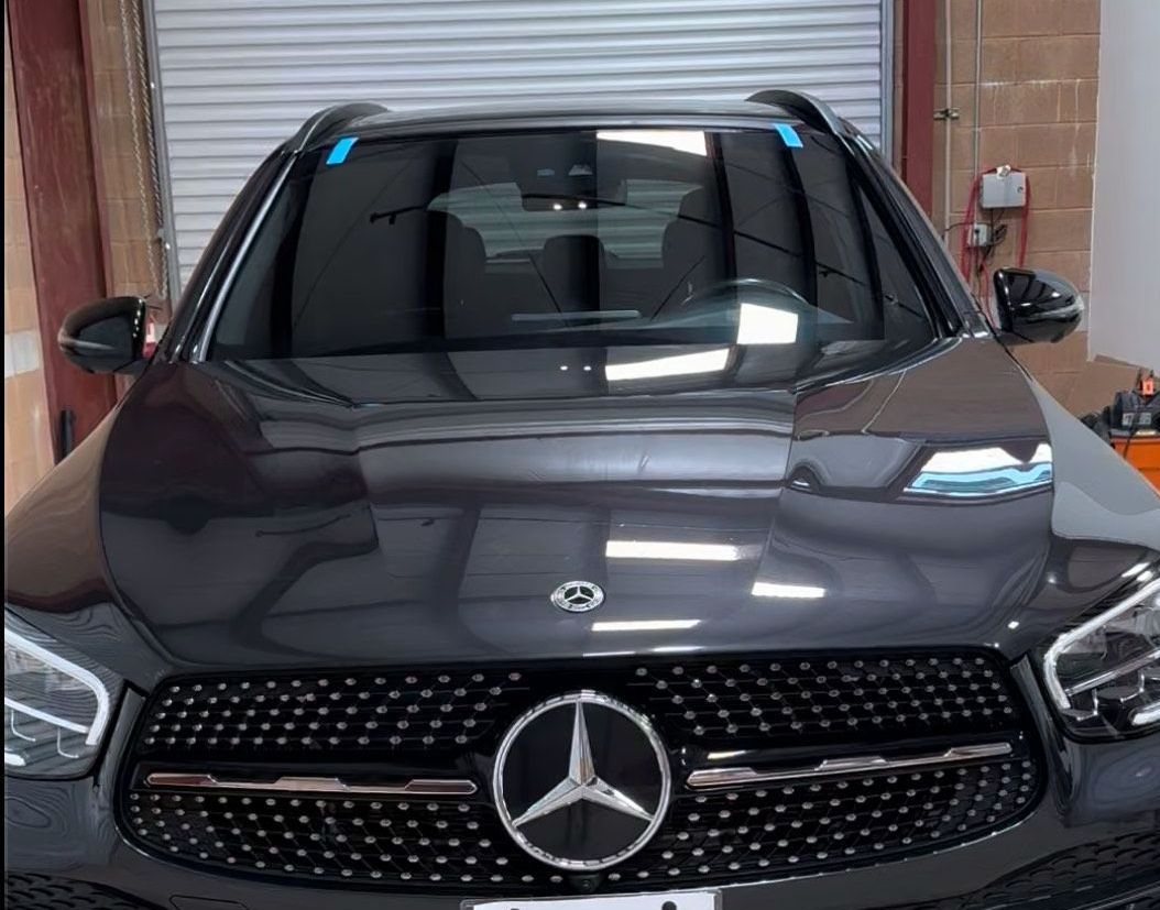 Mercedes ADAS Calibration in Truckee, CA Front view of a black Mercedes-Benz SUV parked indoors near a garage door