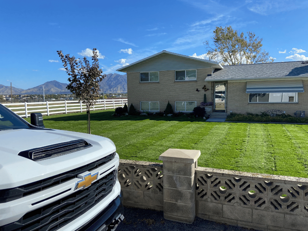 Freshly mowed residential lawn showcasing Redstone's professional lawn care results in Centerville, Utah