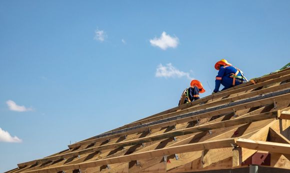 Two man repairing the roof