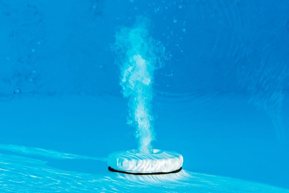A White Object Is In A Swimming Pool — Col Davies Pools In Warners Bay, NSW