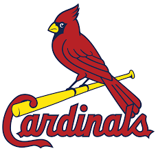 Red cardinal bird perched on a yellow baseball bat,