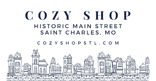 COZY SHOP logo with historic Main Street Saint Charles and illustrated storefront skyline