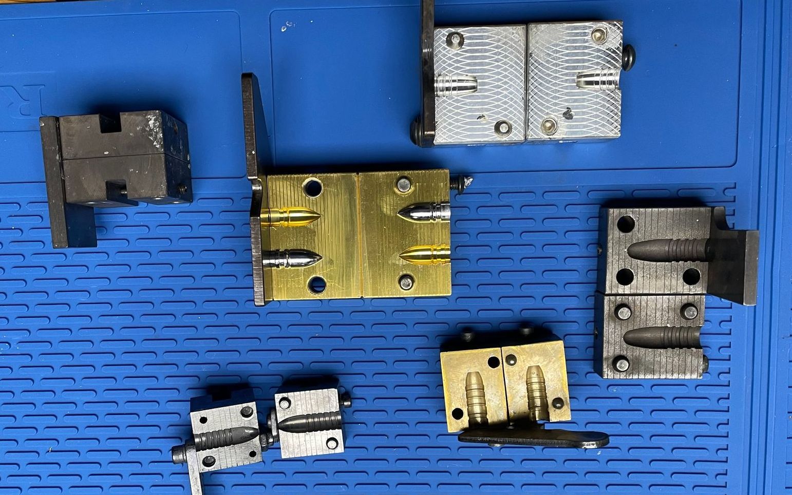 A bunch of metal pieces on a blue surface