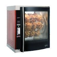 A chicken roaster oven with a chicken inside of it.