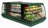 A refrigerator filled with fruits and vegetables in a grocery store.