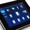 Tablet showing a smart home control dashboard with connected devices on a blue screen