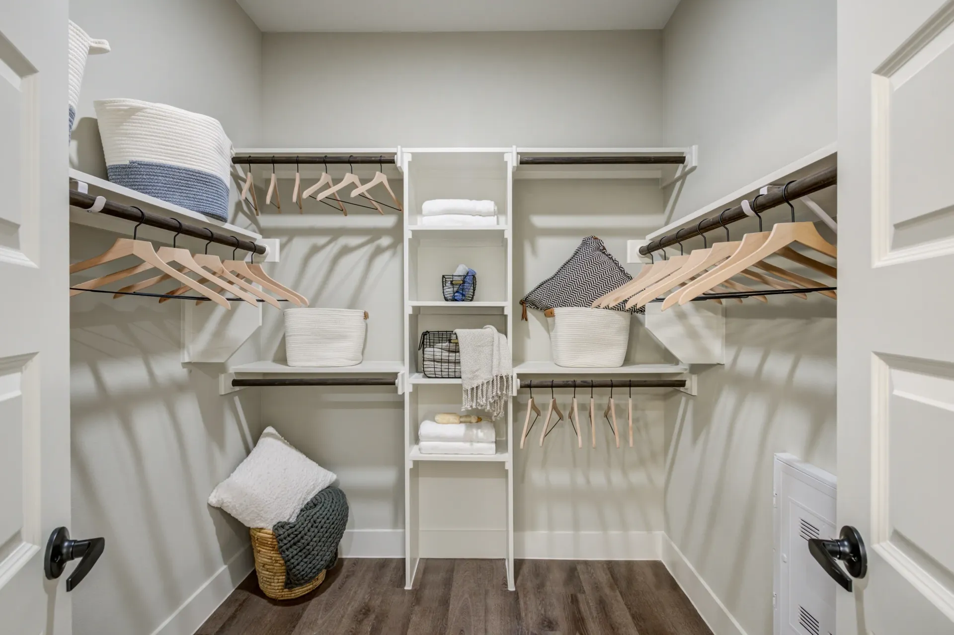 Walk-in closet with shelving and hanging rods.