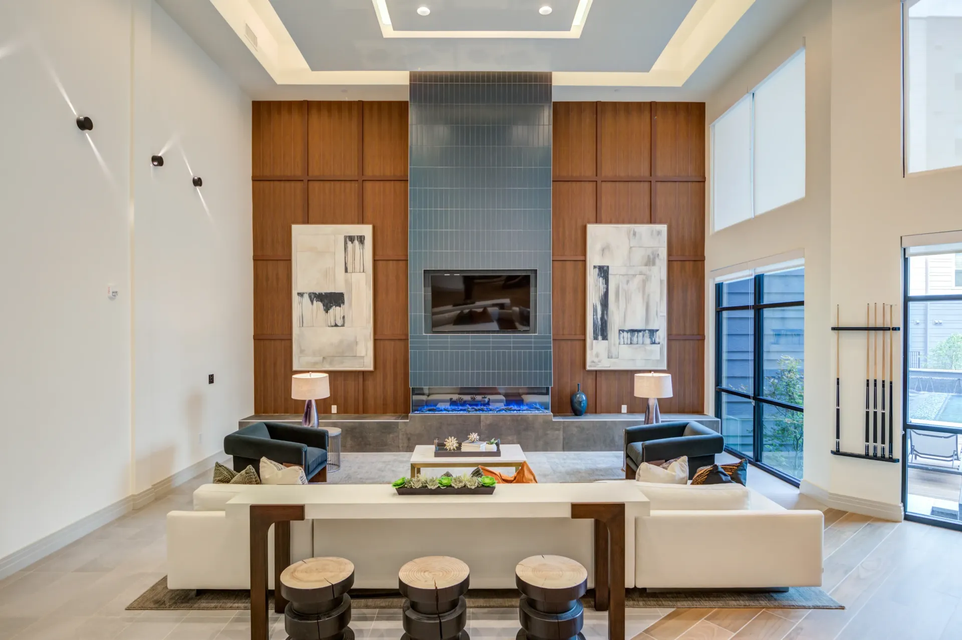 Modern lounge area with fireplace and contemporary art.