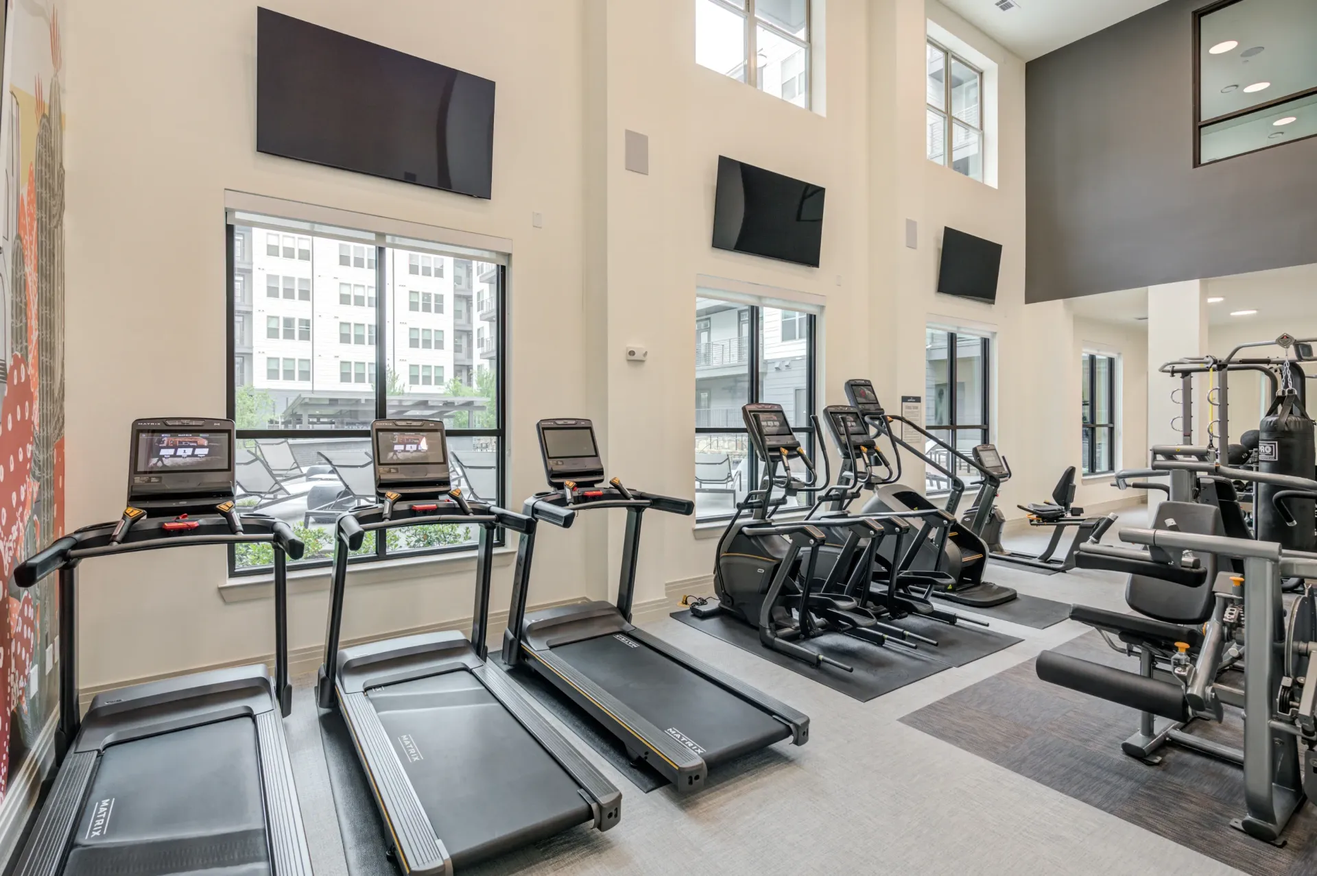 State-of-the-art fitness center with treadmills, elliptical machines, and weight training equipment.