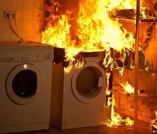 Laundry room fire: Flames engulf washer, dryer, and shelving unit; electrical outlets visible.