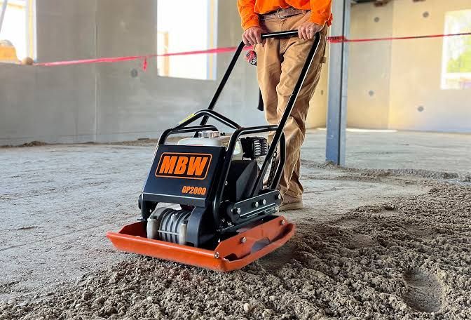 Compaction equipment rental Indianapolis – plate compactor on a gravel sub-base.