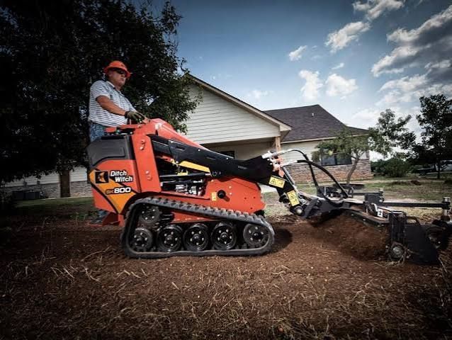 Excavating equipment rental Indianapolis – Bobcat mini excavator digging a utility trench.