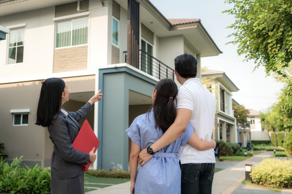 Real Estate Agent and Couple