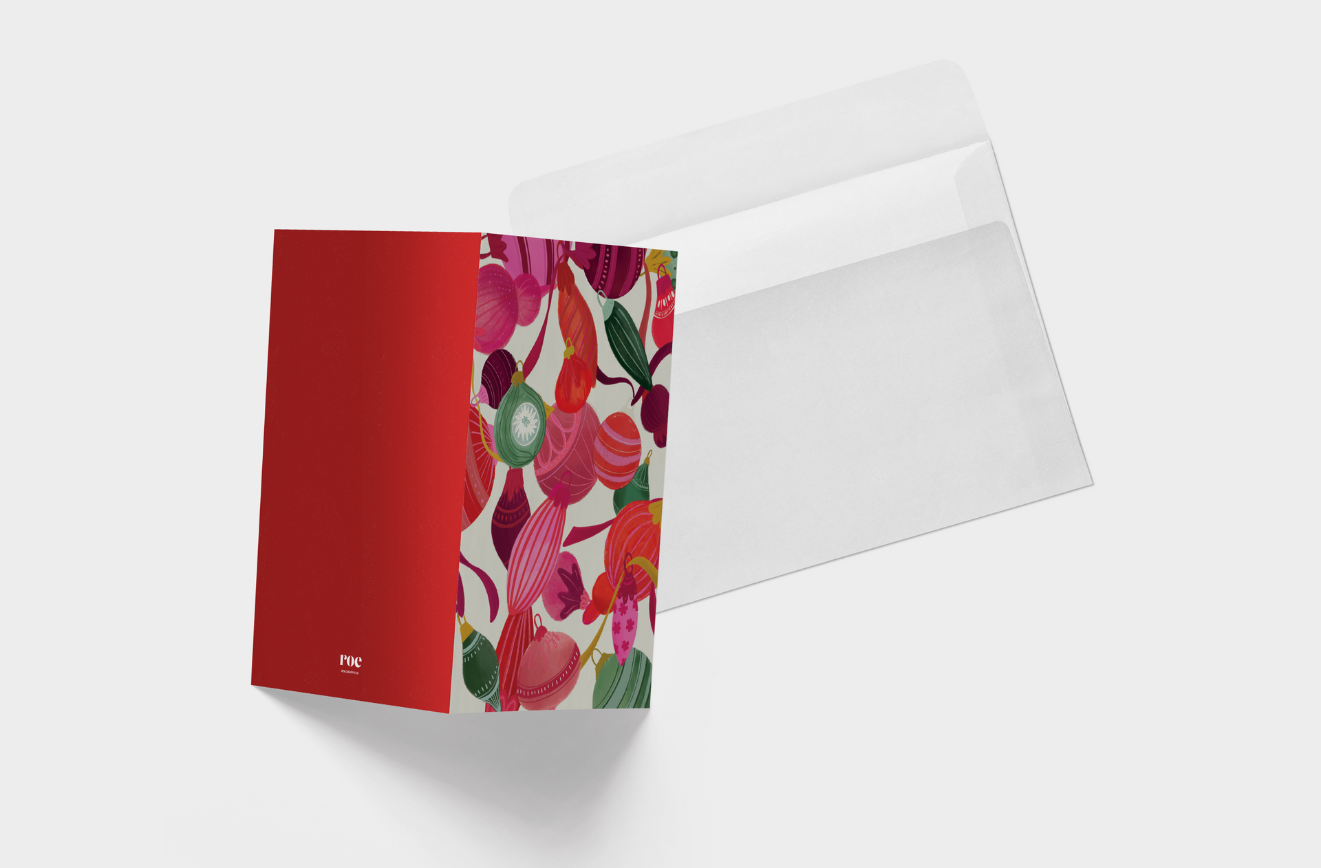 A red folder with a floral pattern on it and a white envelope.