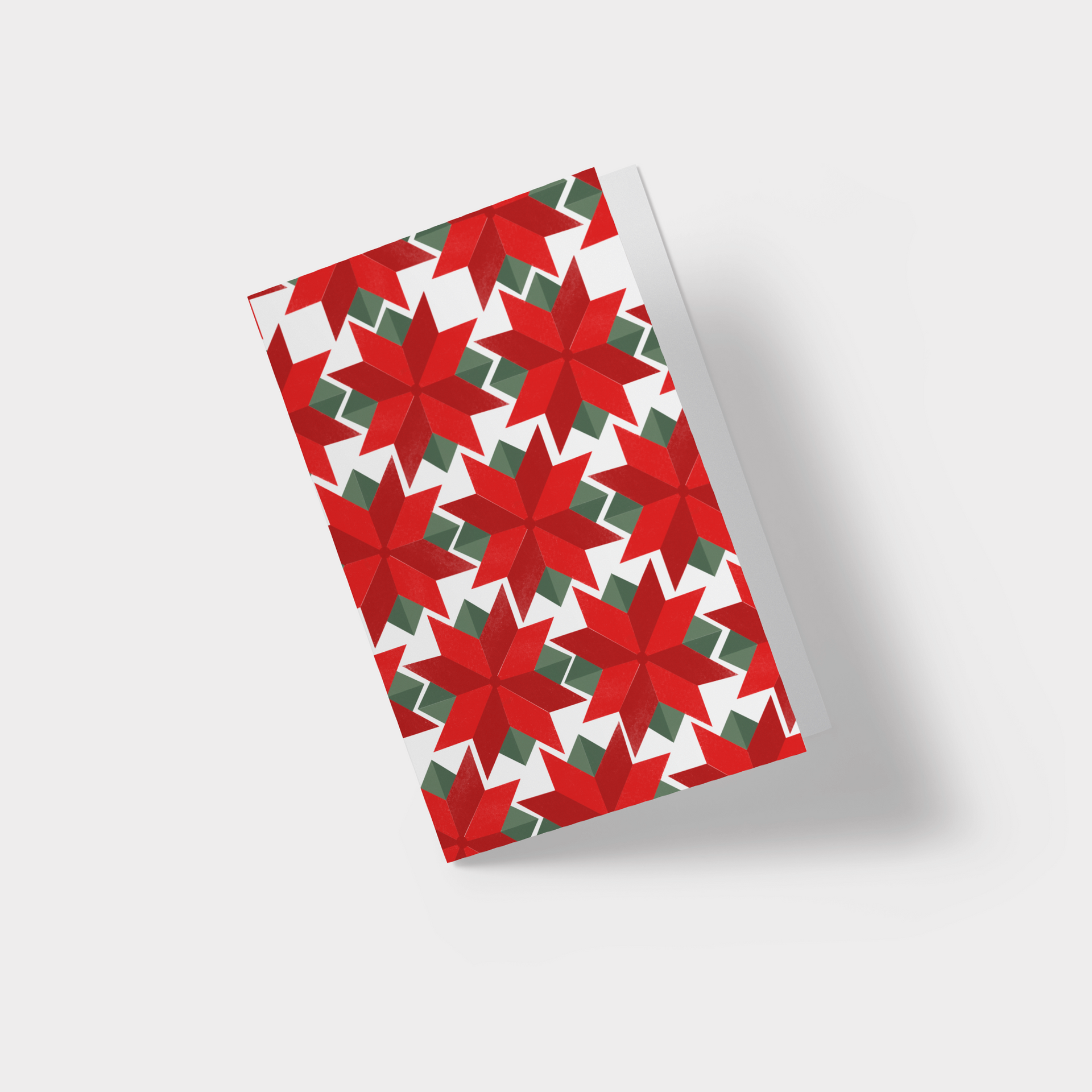 A christmas card with a red and green pattern on it