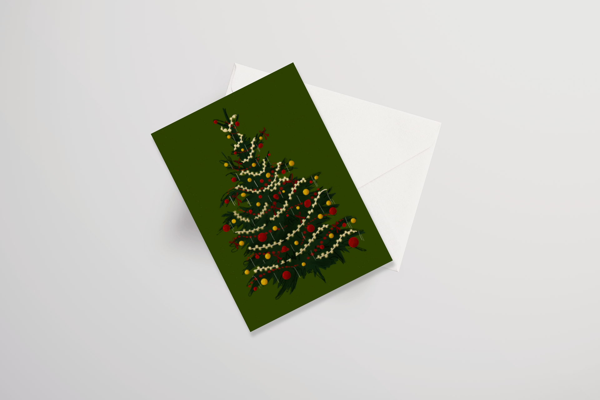 A green christmas card with a christmas tree on it