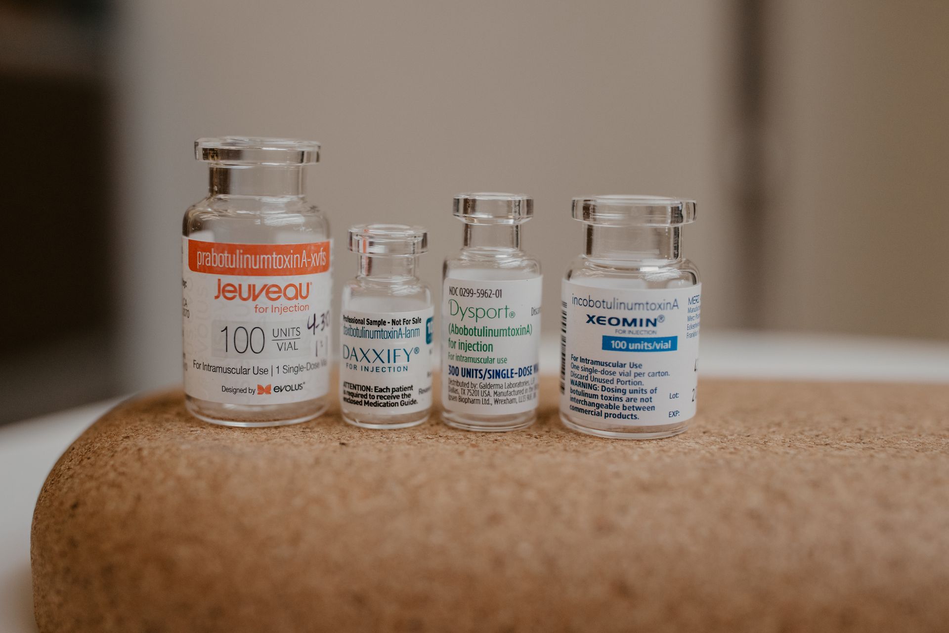 A woman is getting a botox injection in her face.