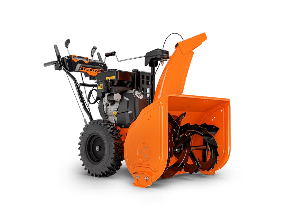 Orange snow blower with black wheels and front auger on a white background