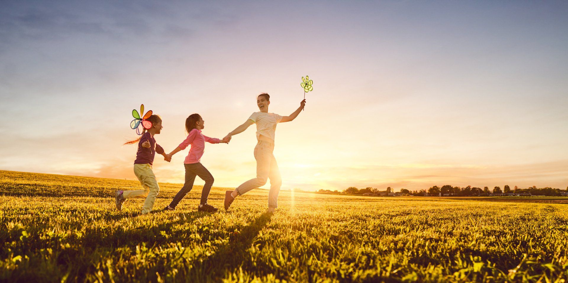 family running through field