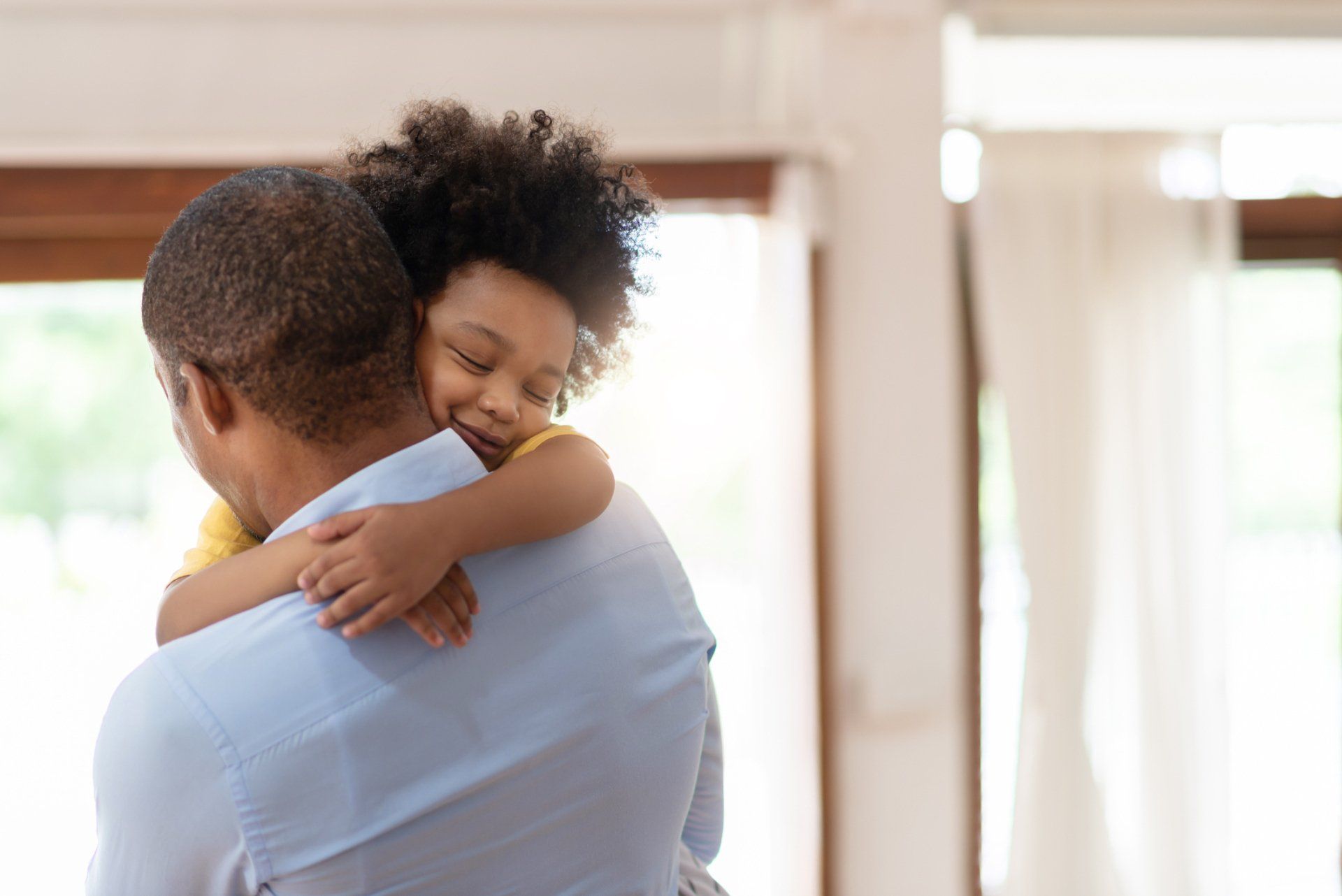 father and daughter hugging