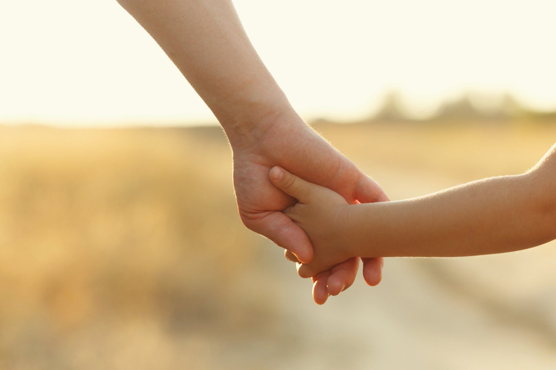parent and child holding hands