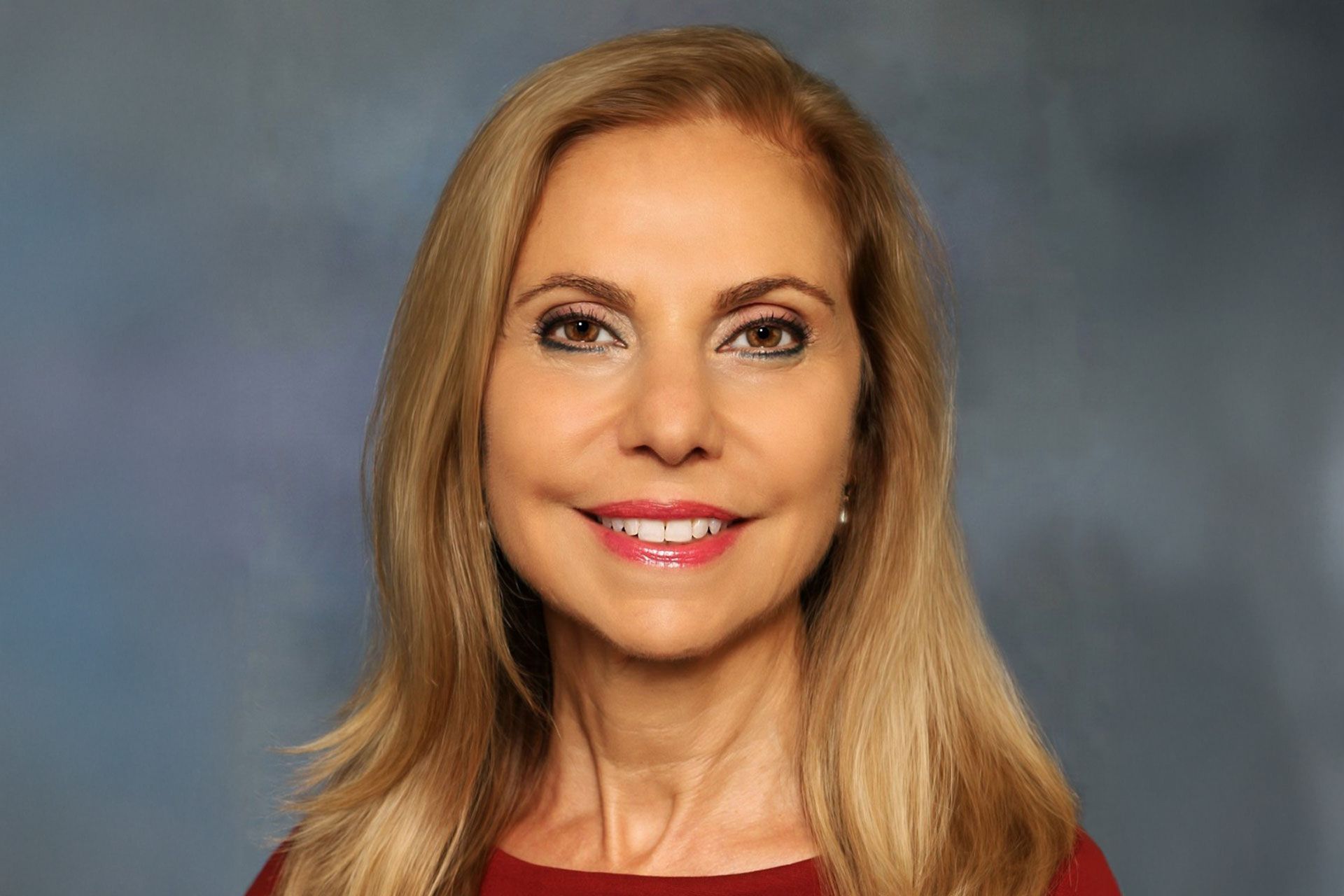 A photo of Dr. Cynthia Matossian smiling for the camera.