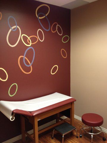 A doctor 's office with circles painted on the wall at Advocare Washington Ave Pediatrics in Bergenfield, NJ