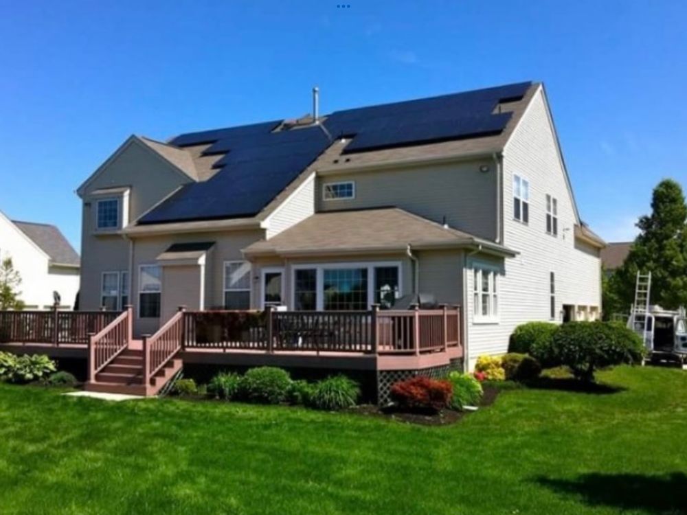 An aerial view of a building with a lot of fans on the roof
