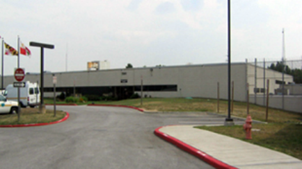 A do not enter sign is in front of a large building