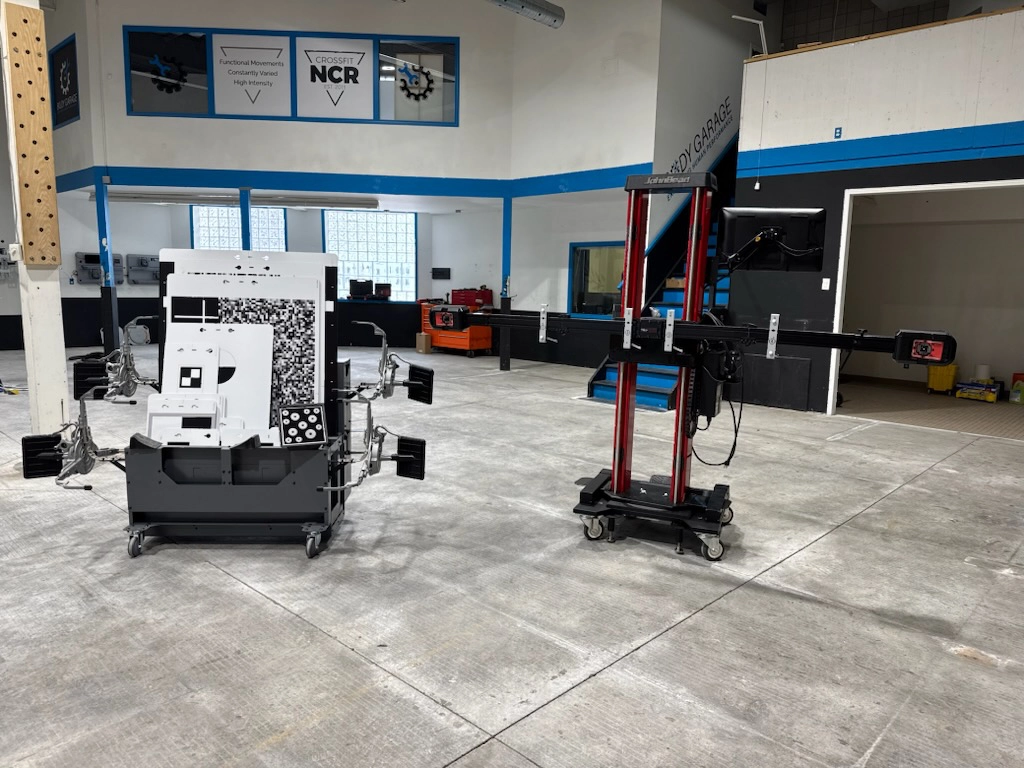 Indoor workshop with two mobile robotics platforms on a concrete floor