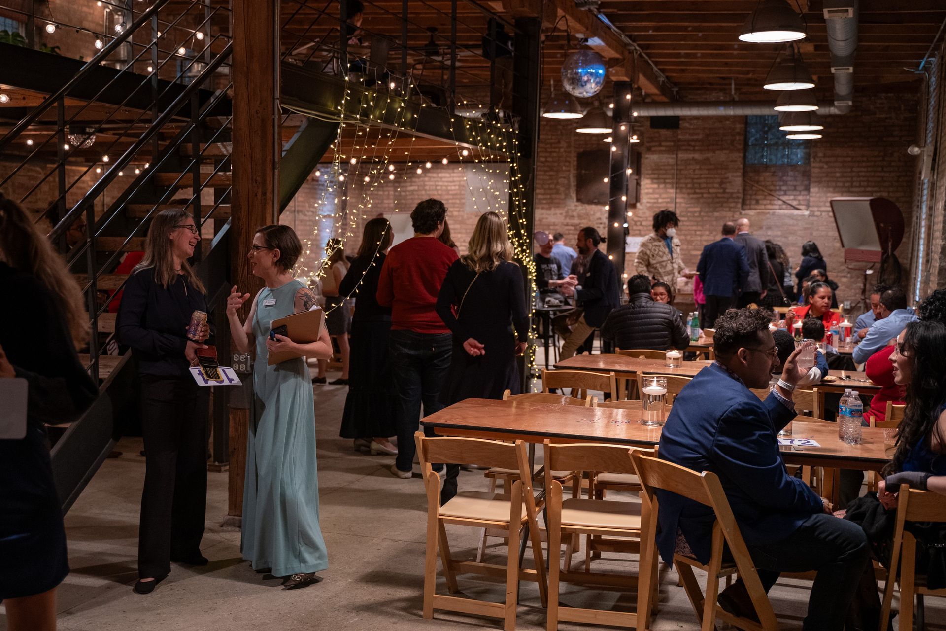 Guests gather for dinner and games.