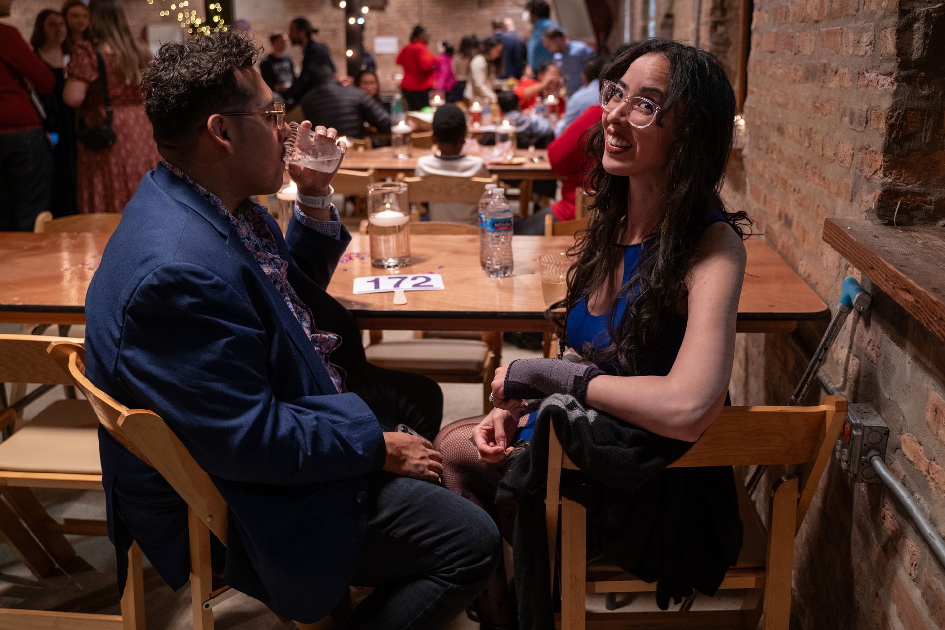 2 KEENFest guests sit at a table during the event